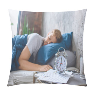 Personality  Selective Focus Of Alarm Clock And Sleeping Man In Bed Behind  Pillow Covers