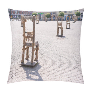Personality  KRAKOW, POLAND - JUNE, 2017: Art Objects With Iron Chairs On Cobblestone Street Erected In Memory Of Jewish Ghetto. Krakow With Popul. Of 800,000, Has 2.35 Mill. Foreign Tourists Annually Pillow Covers