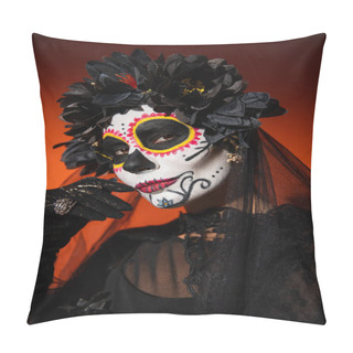 Personality  Woman In Black Wreath And Spooky Halloween Makeup Holding Hand Near Face And Looking At Camera On Orange Background Pillow Covers