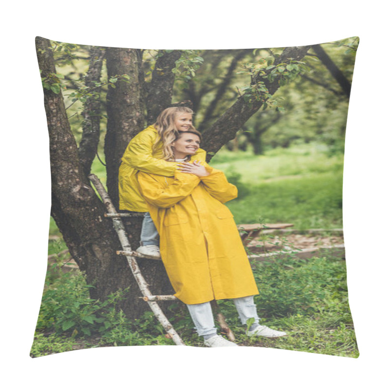 Personality  mother and daughter in raincoats at tree pillow covers
