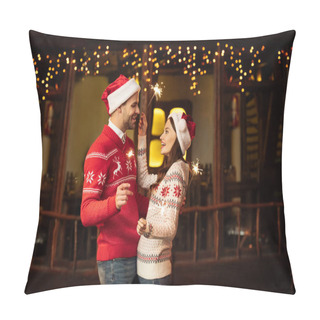 Personality  Cheerful Young Couple In Santa Hats And Warm Sweaters Holding Sparklers While Smiling At Each Other Pillow Covers