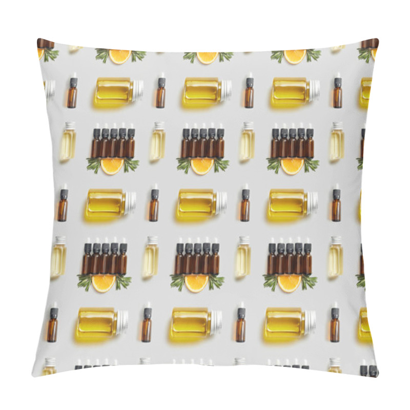 Personality  Pattern with various bottles of essential oil and cut orange on grey background pillow covers