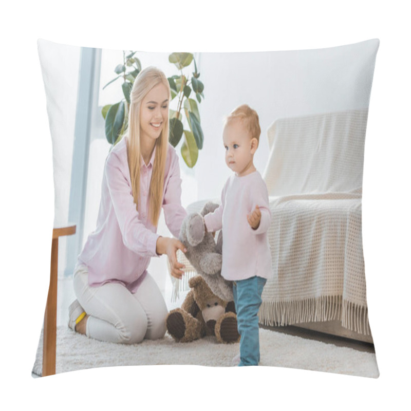 Personality  young woman with little daughter playing toys on carpet pillow covers
