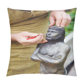 Personality  Closeup Hands Of Sculptor In Apron Making Sculpture Of Man Using Instrument Outdoor Pillow Covers