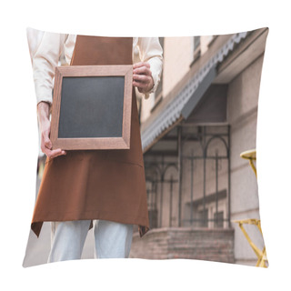 Personality  Cropped View Of Barista In Brown Apron Holding Chalkboard Menu On Street Pillow Covers