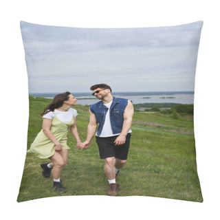 Personality  Positive And Stylish Brunette Woman In Sundress And Boots Holding Hand And Looking At Boyfriend In Sunglasses And Walking Together On Grassy Field, Couple In Love Enjoying Nature, Tranquility Pillow Covers