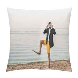 Personality  Surprised Man In Black Jacket, Shorts And Flippers Touching Swimming Mask On Beach Near Sea Pillow Covers