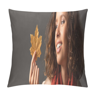 Personality  Panoramic Shot Of Smiling Woman In Trench Coat Holding Golden Maple Leaf On Black Background Pillow Covers