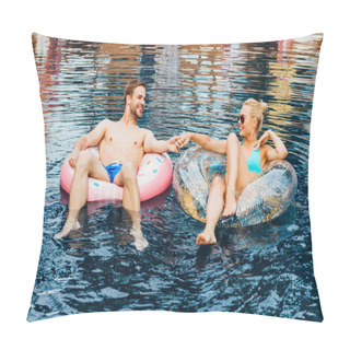 Personality  Smiling Couple Holding Hands And Looking At Each Other While Lying On Swim Rings In Pool Pillow Covers