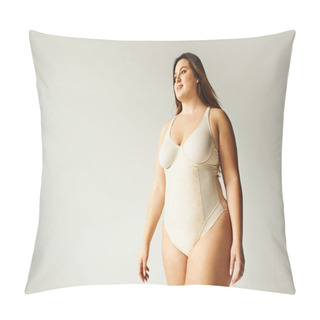 Personality  Happy Plus Size Woman In Beige Bodysuit Posing While Standing In Studio On Grey Background, Body Positive, Figure Type, Self-esteem, Smiling While Looking Away  Pillow Covers