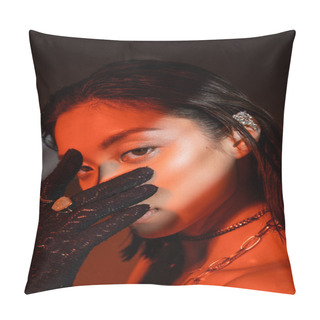 Personality  Portrait Of Alluring Asian Woman With Short Hair And Wet Hairstyle Posing In Black Glove With Golden Rings And Covering Face While Looking At Camera On Dark Background With Red Lighting, Cuff Earring  Pillow Covers