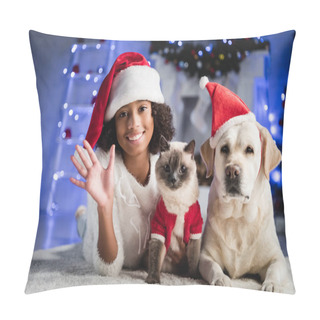 Personality  Happy African American Girl With Waving Hand Lying On Floor Near Cat And Labrador In Santa Hat On Blurred Background Pillow Covers