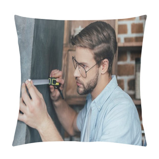Personality  Young Man In Eyeglasses Measuring Wall With Tape At Home Pillow Covers