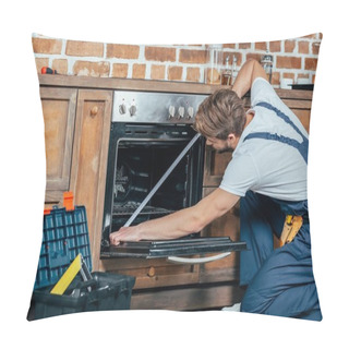 Personality  Young Foreman In Protective Workwear Measuring Oven With Tape  Pillow Covers