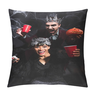 Personality  Spooky African American Woman In Werewolf Mask Holding Toy Hand Near Scary Man With Carved Pumpkin On Black   Pillow Covers