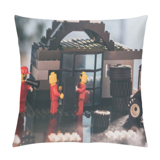Personality  KYIV, UKRAINE - MARCH 15, 2019: Lego Minifigures In Red Carrying Tire While Other Figurine Shouting In Mouthpiece At Service Station Pillow Covers