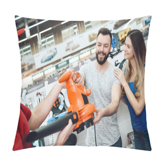 Personality  Salesman Is Giving New Leaf Blower To Couple Of Clients In Power Tools Store. Pillow Covers
