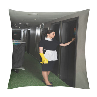 Personality  Full Length Of Smiling Maid Knocking Door In Corridor Of Hotel  Pillow Covers