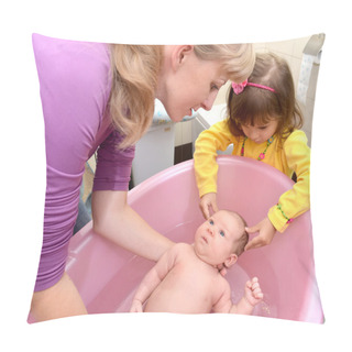 Personality  The Three-year-old Girl Helps Mother To Bathe The Baby In A Pink Pillow Covers