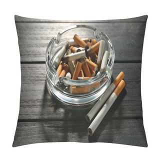 Personality  Glass Ashtray With Cigarette Stubs On Black Wooden Table Pillow Covers