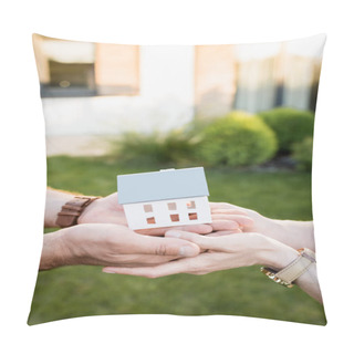 Personality  Cropped View Of House Statuette In Hands Of Couple On Blurred Background Pillow Covers