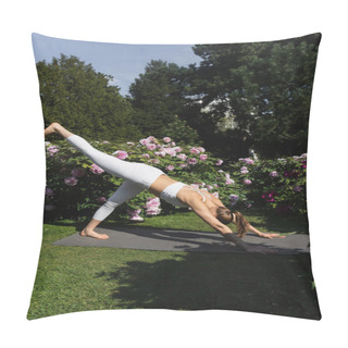 Personality  Sportive Woman Practicing Downward-facing Dog Pose With Raised Leg On Yoga Mat In Park Pillow Covers