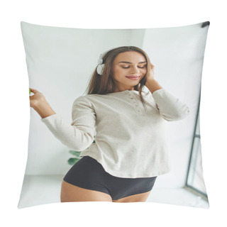 Personality  Joyful Woman In Long Sleeve And Panties Listening Music In Headphones And Holding Apple Pillow Covers