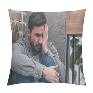 Personality  Upset Man Sitting In Corner, Covering Eye With Hand On Brown Textured Background In Room, Grieving Disorder Concept Pillow Covers
