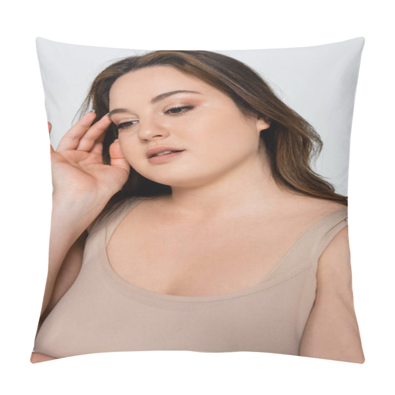Personality  Portrait of brunette woman with overweight touching face isolated on grey pillow covers