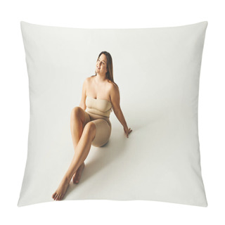 Personality  Full Length Of Barefoot And Joyous Woman With Plus Size Body In Strapless Top With Bare Shoulders And Underwear Posing While Sitting In Studio On Grey Background, Body Positive, Figure Type  Pillow Covers