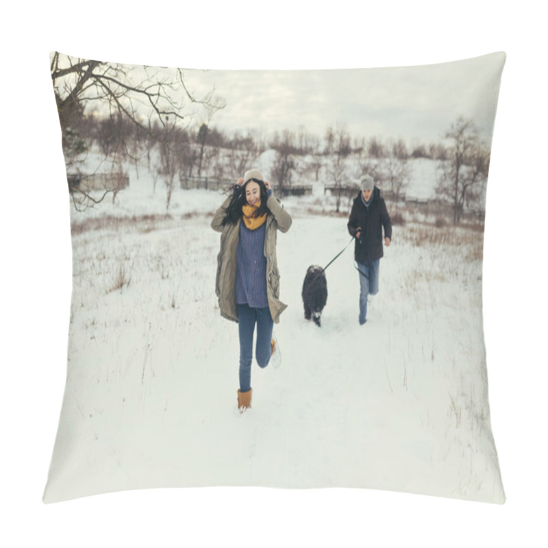 Personality  Young couple walking with a dog in a winter day pillow covers