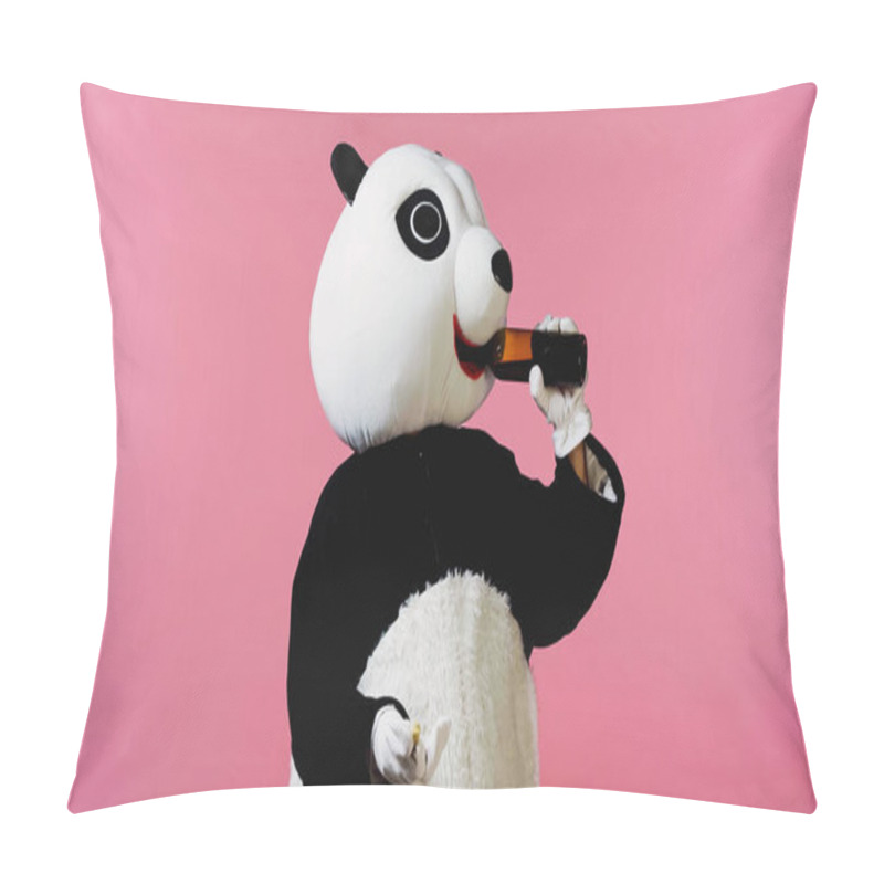 Personality  person in panda bear costume drinking wine from bottle and holding cork isolated on pink pillow covers