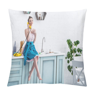 Personality  Happy Young Woman In Apron Sitting On Table And Talking On Retro Yellow Telephone In Kitchen   Pillow Covers