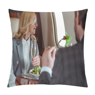 Personality  Selective Focus Of Businesswoman Holding Glass Of Champagne Near Businessman Eating Salad In Plane  Pillow Covers