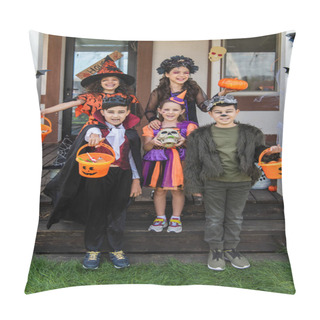 Personality  Cheerful Multiethnic Friends In Halloween Costumes Holding Buckets With Candies Near Decorated Cottage Pillow Covers