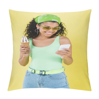 Personality  Happy African American Woman In Sunglasses Holding Ice Cream Cone And Using Smartphone Isolated On Yellow Pillow Covers