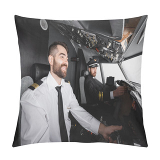 Personality  Cheerful Co-pilot Using Yoke Near Captain Reaching Control Panel In Airplane Simulator  Pillow Covers