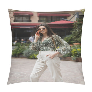 Personality  Cheerful Young Woman With Long Hair And Sunglasses Smiling While Talking On Smartphone And Standing With Hand In Pocket And Handbag On Chain Strap Near Blurred Building And Plants In Istanbul  Pillow Covers