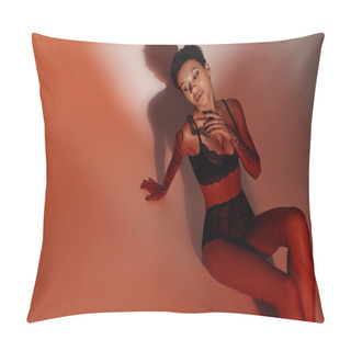 Personality  High Angle View Of Sensual Tattooed Woman In Black Lace Lingerie On Red And Brown Background Pillow Covers