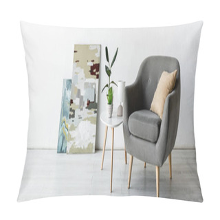 Personality  Panoramic Crop Of Comfortable Armchair Near Coffee Table With Green Plants, Lamp And Paintings In Living Room  Pillow Covers