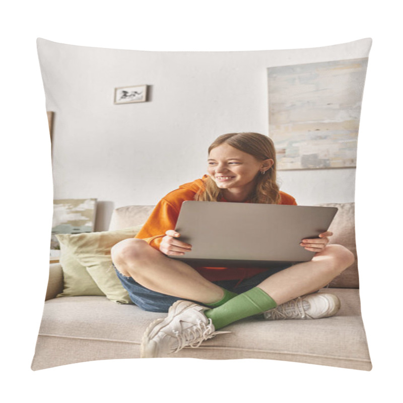 Personality  cheerful teenager girl with a laptop enjoying her time and sitting on the sofa in living room pillow covers