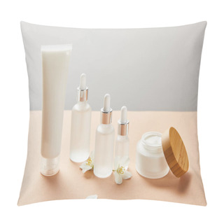 Personality  Cream Tube, Cosmetic Glass Bottles With Serum And Open Jar With Cream Near Few Jasmine Flowers Pillow Covers
