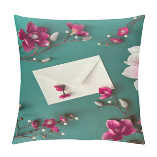 Personality  A White Envelope Decorated With Delicate Magnolia And Plum Pink Flowers Resting On A Vibrant Green Background. Pillow Covers