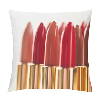 Personality  Selective Focus Of Various Red Shades Of Lipstick In Tubes Isolated On Grey  Pillow Covers