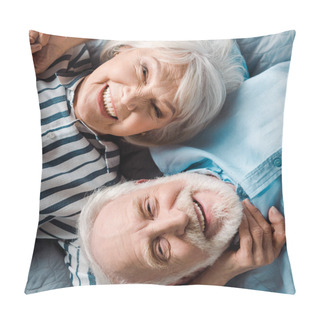 Personality  Top View Of Elderly Couple Smiling At Camera While Lying On Bed Pillow Covers