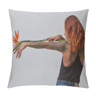 Personality  Sexy Young Girl With A Tattoo Holds An Orange Strelitzia Flower Around A Gray Background With Copy Space. Layout For Your Ideas Pillow Covers