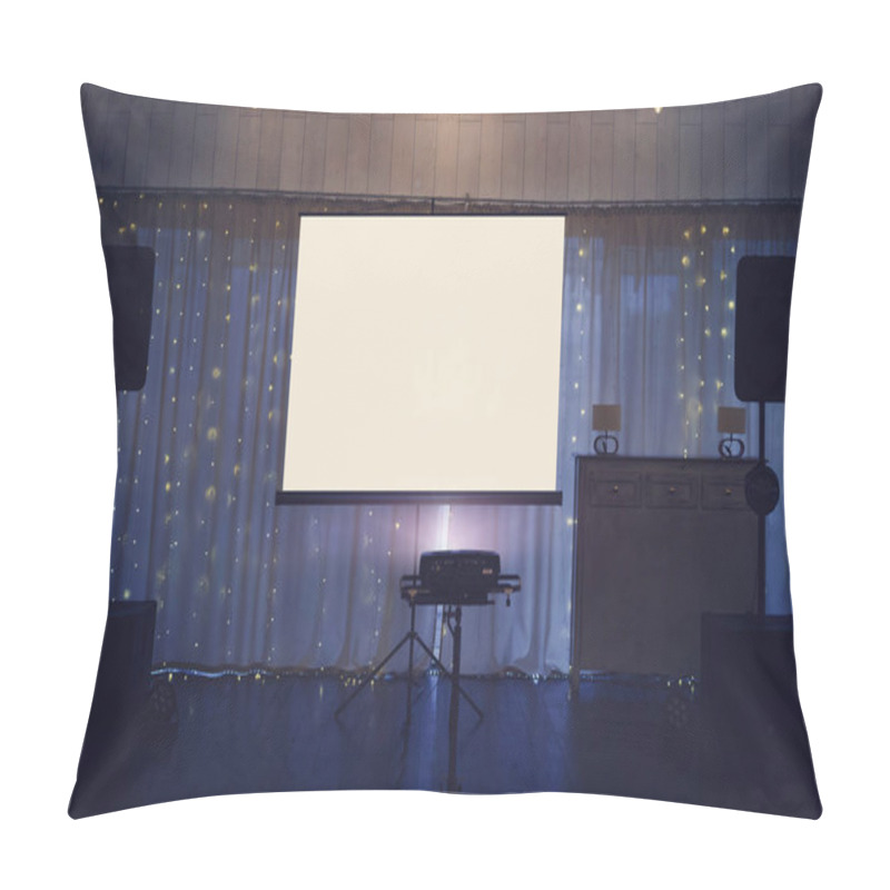 Personality  Illuminated Banquette Hall Stage With A Big White Screen And Acoustic Systems. Equipment For Video And Audio Projection At A Festive Event. Banquette Stage With A Board For Projection In The Centre. Pillow Covers