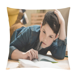 Personality  Selective Focus Of Thoughtful Boy Lying On Floor Near Copy Book While Making Schoolwork At Home Pillow Covers