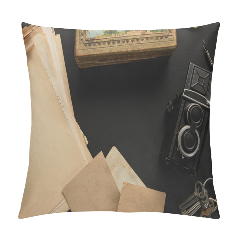 Personality  top view of vintage camera, paper, painting, fountain pen, keys on black background pillow covers