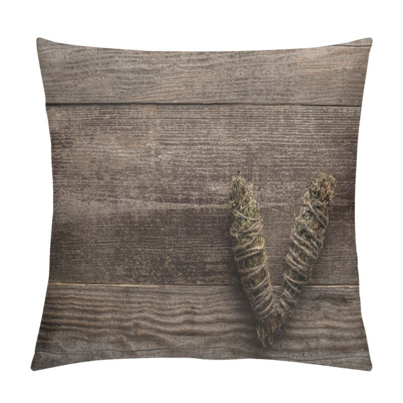 Personality  Top view of herbal smudge sticks on wooden background pillow covers